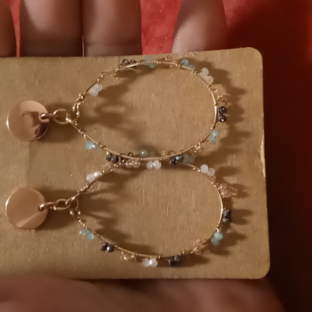 Rose gold hoops with blue crystals.wire wrapped crystals.